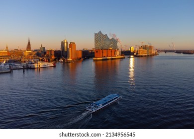 Wonderful view over Hamburg harbour and the Elbphilharmonie Concert Hall at sunset - drone photography Germany from above - HAMBURG, GERMANY - DECEMBER 21, 2021