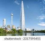 Wonderful view of park and skyscraper at downtown of Seoul, South Korea. Amazing modern tower is visible on blue sky background. Scenic cityscape. Seoul is a popular tourist destination of Asia.