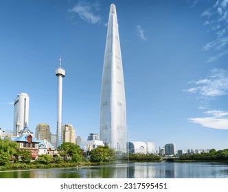 Wonderful view of park and skyscraper at downtown of Seoul, South Korea. Amazing modern tower is visible on blue sky background. Scenic cityscape. Seoul is a popular tourist destination of Asia. - Shutterstock ID 2317595451
