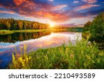 A wonderful view of a quiet lake in the forest in the evening. Location place Small Polissya, Ukraine, Europe. Photo of nature concept. Perfect summertime wallpaper. Discover the beauty of earth.