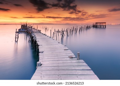 Wonderful Wooden Jetty In The Portuguese Town Of Comporta, It Continues To Resist The Inclement Weather, Although Its Deterioration Is Becoming More And More Noticeable.