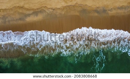 Similar – Aerial Drone View Of Blue Ocean Waves And Beautiful Sandy Beach Shore in Portugal