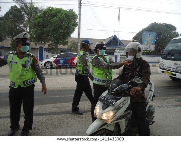 Wonogiri,\
Indonesia-Indonesian Police Officer in charge of serving the\
community. 14 February,\
2014