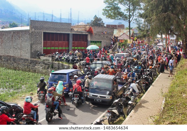 Wonosobo , Central Java/\
Indonesia -August 17 2019:car and motorcycle congestion in\
Indonesia