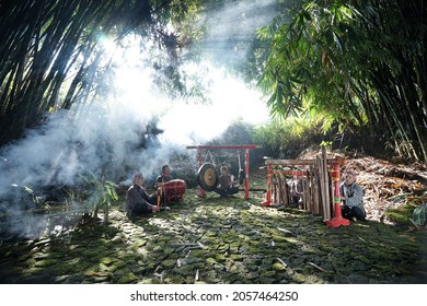 Wonosobo, Indonesia - 3 Oct 2021: Traditional Gamelan Player Playing Javanese Music With Bamboo Tree Background In The Morning 