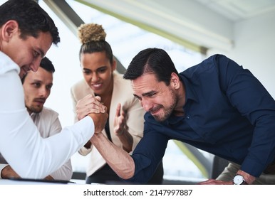 I Wont Give Up That Easily. Shot Of Two Businessmen Arm Wrestling In An Office.