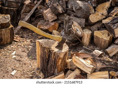 Wood axe and wood pile outdoor woodcutter logs