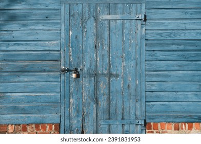 Wood Background Grain Texture Wall with Metal Hinges,Old Wood Door Rustic Gate with Locked,Garage Door with Padlock,Barn entrance with blue peeling paint,Exterior Vintage Building