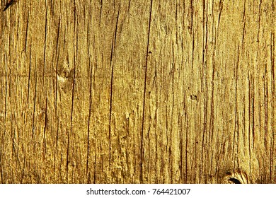 Wood Background With A Thin Layer Of Gold Paint.