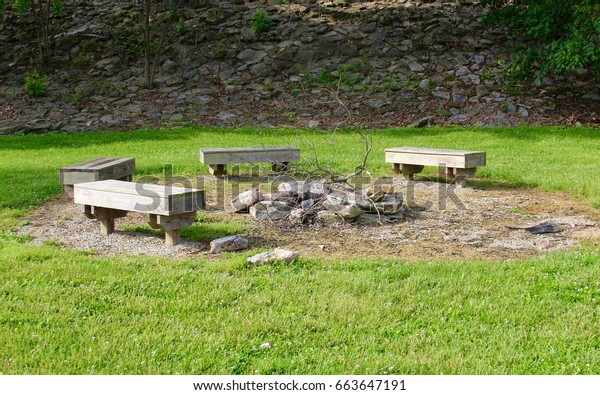 Wood Benches Around Stone Rock Fire Stock Photo Edit Now 663647191