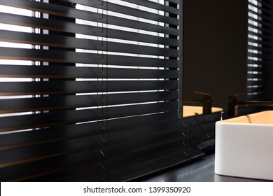 Wood blinds black color closeup on the window. Wooden plate 50mm wide. Venetian blinds in the bathroom. Black tap, mirror near the washbasin.