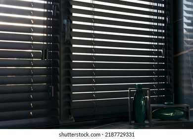Wood blinds black color closeup on the window. Wooden slats 50mm wide. Venetian bamboo blinds in the kitchen. Black tapes. Green vases on the windowsill. Stone countertop.