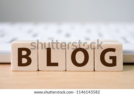 Wood block cube put the front computer keyboard with word BLOG and empty copy space for your text