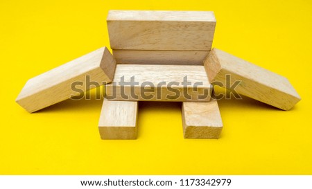 wood block on yellow background