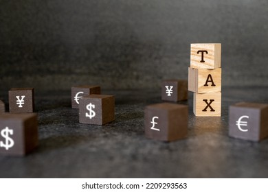 Wood Block Representation Of Reserve Currency And Taxes