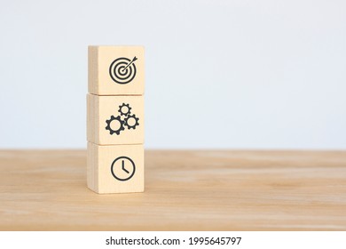 Wood block to show concept business, gold target, time to start, new idea starting up on white background. - Shutterstock ID 1995645797