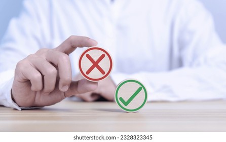 wood block showing right and wrong sign decision concept, vote and think yes or no Business options for difficult situations true and false symbol. select the wrong mark