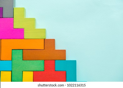 Wood block stacking as step stair. Step by step to the top on blue paper. Business growth concept picture.building success foundation process - Shutterstock ID 1022116315