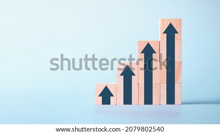 Wood block stacking as step stair with Growing arrow up in concept business growth success for forward achievement concept.