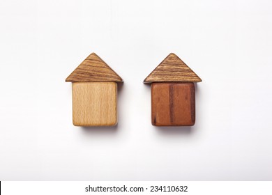 The Wood Blocks Like Two House(real Estate) Isolated White, Top View At The Studio.