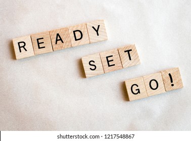 Wood Blocks Spell Ready Set Go! On A White Background. Education And Business Concepts