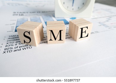 Wood Blocks With Word Sme On Office Table