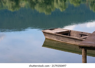 Wood Boat Swim Near The Small Jetty Close Up