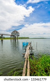 Wood bridge into the lake, Thailand