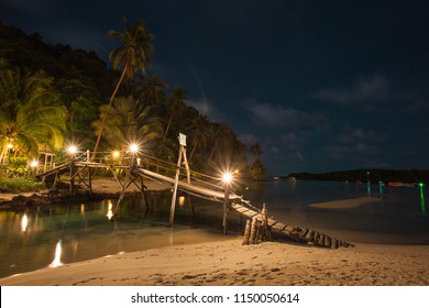 Wood Bridge On The Beach At Night Time, Thailand Island, Night Picture Have Noise Film.