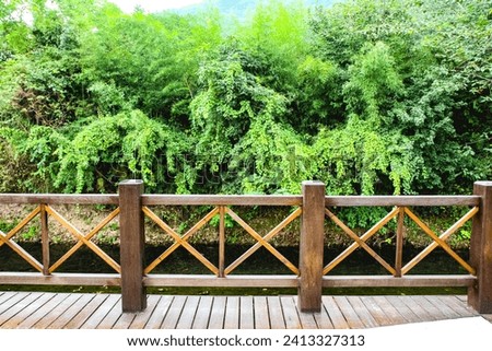 Wood bridge over lake, wooden bridge in the park.The bridge built, beautiful wood bridge background is green garden at the summer.