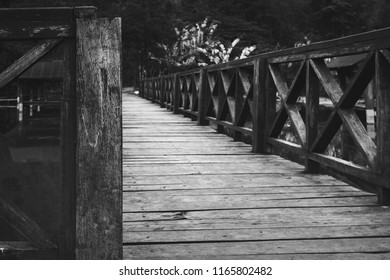 Wood Bridge Vanishing Point Perspective At Sunset, Black And White Picture.