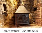 A wood burning and multi-fuel stove in an inglenook fireplace