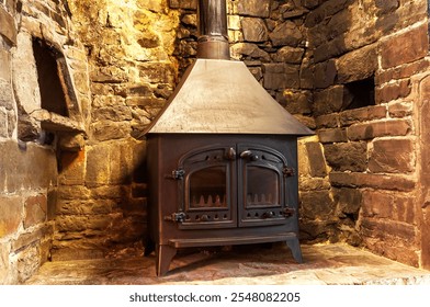 A wood burning and multi-fuel stove in an inglenook fireplace - Powered by Shutterstock