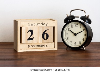 Wood Calendar With Date And Old Clock. Saturday 26 November