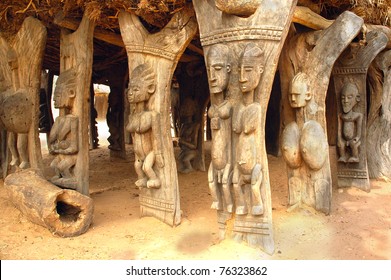 Wood carved human figures supporting a Dogon building in Mali