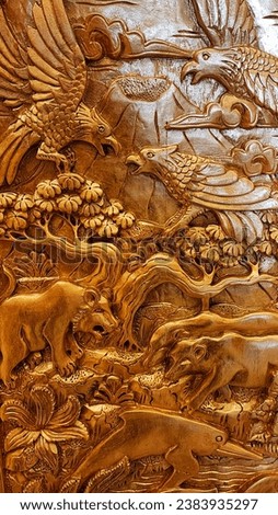 Wood carving in bali, closeup of photo