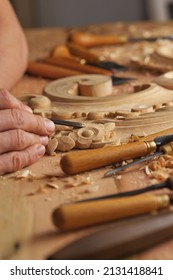 Wood Carving. Carpenter's Hands Use Chiesel. Senior Wood Carving Professional During Work. Man Working With Woodcarving Instruments