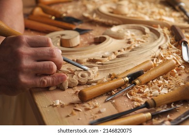 Wood Carving. Carpenter's Hands Use Chiesel. Senior Wood Carving Professional During Work. Man Working With Woodcarving Instruments