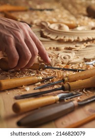 Wood Carving. Carpenter's Hands Use Chiesel. Senior Wood Carving Professional During Work. Man Working With Woodcarving Instruments