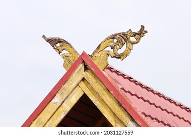 Wood Carving With Yellow Paint On The Roof (Malay Custom)