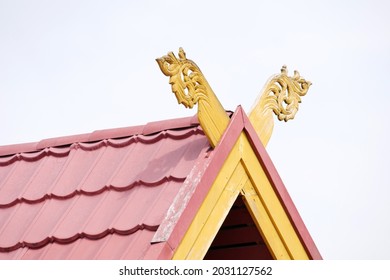 Wood Carving With Yellow Paint On The Roof (Malay Custom)