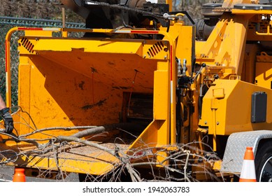 Wood chipper machine releasing the shredded woods into a truck mulch - Shutterstock ID 1942063783