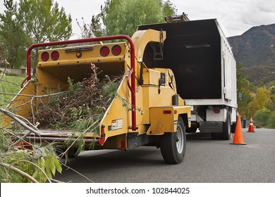 Wood chipper is ready to be use on a cloudy day. - Shutterstock ID 102844025