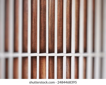 Wood cladding wall which various tone texture of wooden stripes use as partition or seamless fence in vertical line which use as building facade decoration and modern household or contemporary office. - Powered by Shutterstock