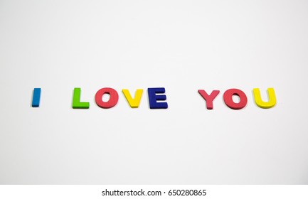 Wood colorful of word is i love you , isolated on white background ( Word Concept)