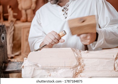wood craftsman working in a mediterranean workshop; photographed during the medieval days, held in the city of Avila, Spain, during the month of September 2019


