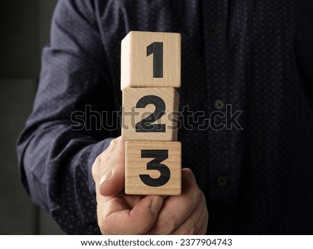 Wood cube stack 1 2 3 priority. Priorities and business important planning urgency concept. Wooden block number using as business competition concept