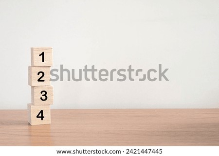 Wood cube stack alphabet text  1 2 3 4 PRIORITY on white background.
PRIORITIES and business important planning urgency concept.