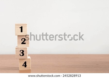 Wood cube stack alphabet text  1 2 3 4 PRIORITY on white background.
PRIORITIES and business important planning urgency 1234 concept.