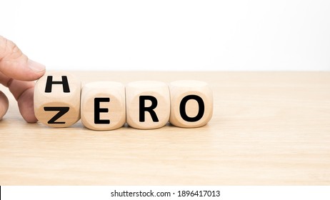 Wood cube zero or hero on wooden table wooden white background. 
Concept winner and loser effect.